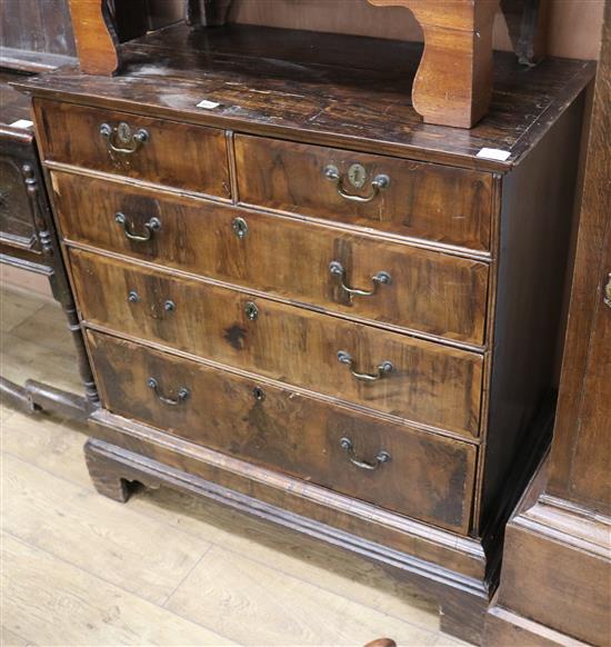 An early 18th Century walnut chest of two short and three long graduated drawers, on bracket feet (adapted from a chest on chest) W.100